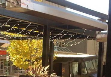 restaurant-outdoor-heaters-mounted-above-patio-furniture