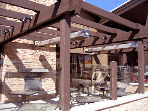 infrared-patio-heaters-under-pergola-with-fireplace