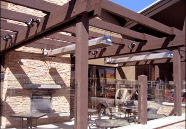infrared-patio-heaters-under-pergola-with-fireplace