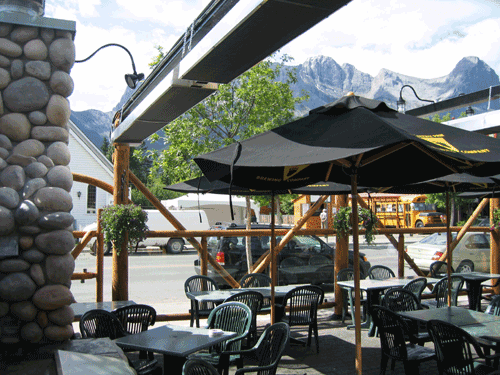 outdoor-infrared-patio-heaters-above-patio-with-umbrellas